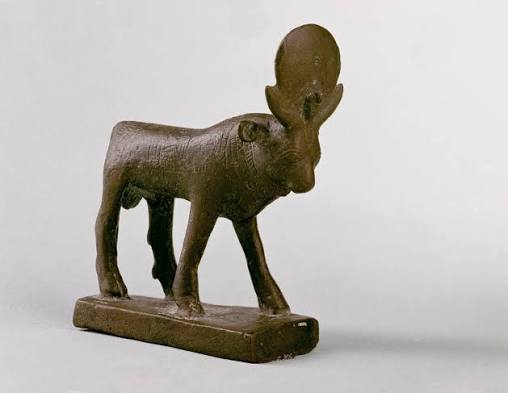 Small bronze statuette of the Apis bull with sun disc and uraeus between the horns, ancient Egypt, museum collection